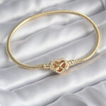 Pirinç Gold Renk Zirkon Taşlı Kalp Sonsuzluk Model Charm Kadın Bileklik