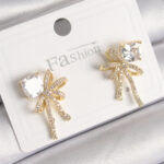 Pirinç Gold Renk Zirkon Taşlı Kurdele Model Kadın Küpe