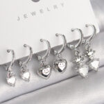 Pirinç Gümüş Renk Sallantı Zirkon Taşlı Kalp Model Taç Detay Kadın Küpe Seti