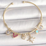 Pirinç Gold Renk Zirkon Taşlı Sallantı Kutup Yıldız Figür İnci Detay Charm Kadın Bileklik