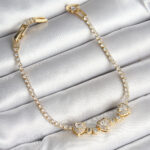 Pirinç Sıralı Kalp Figürlü Zirkon Taşlı Gold Renk Kadın Bileklik