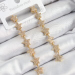 Pirinç Zirkon Taşlı Sallantılı Yıldız Model Gold Renk Kadın Küpe