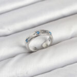 Pirinç Gümüş Renk Mavi Zirkon Taşlı Kutup Yıldızı Model Kadın Yüzük