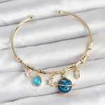 Gezegen Charmlı Gold Renk Pirinç Kadın Bileklik